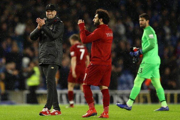 BRIGHTON, ENGLAND - JANUARY 12:  Jurgen Klopp, Manager of Liverpool and Mohamed Salah of Liverpool show appreciation to the fans following their sides victory in the Premier League match between Brighton & Hove Albion and Liverpool FC at American Express Community Stadium on January 12, 2019 in Brighton, United Kingdom.  (Photo by Bryn Lennon/Getty Images)