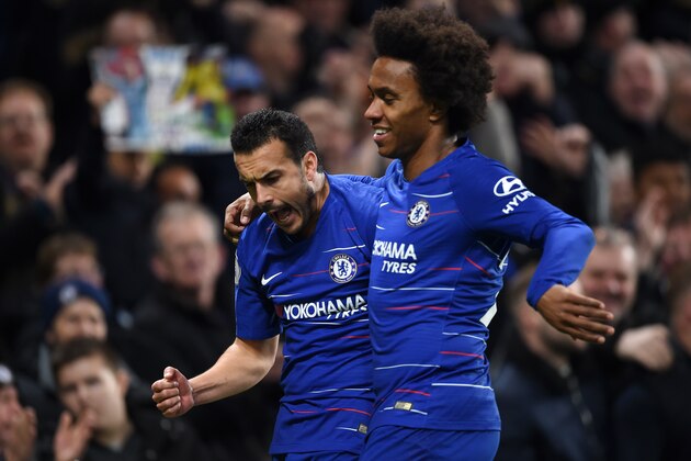 LONDON, ENGLAND - JANUARY 12:  Pedro of Chelsea celebrates with teammate Willian after scoring his team's first goal during the Premier League match between Chelsea FC and Newcastle United at Stamford Bridge on January 12, 2019 in London, United Kingdom. (Photo by Harriet Lander/Copa/Getty Images)