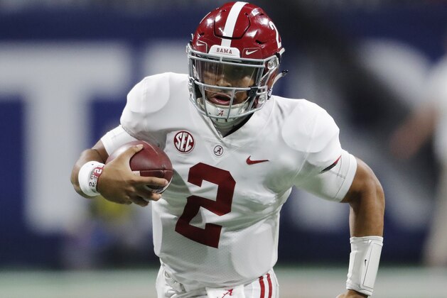 Alabama quarterback Jalen Hurts (2) runs past Georgia linebacker Walter Grant (84) during the second half of the Southeastern Conference championship NCAA college football game, Saturday, Dec. 1, 2018, in Atlanta. (AP Photo/John Bazemore)