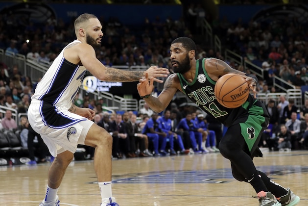 Boston Celtics' Kyrie Irving, right , drives around Orlando Magic's Evan Fournier during the second half of an NBA basketball game, Saturday, Jan. 12, 2019, in Orlando, Fla. (AP Photo/John Raoux)
