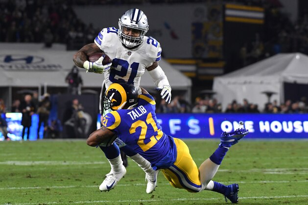 LOS ANGELES, CA - JANUARY 12: Aqib Talib #21 of the Los Angeles Rams tackles Ezekiel Elliott #21 of the Dallas Cowboys in the second quarter in the NFC Divisional Playoff game at Los Angeles Memorial Coliseum on January 12, 2019 in Los Angeles, California.  (Photo by Harry How/Getty Images)