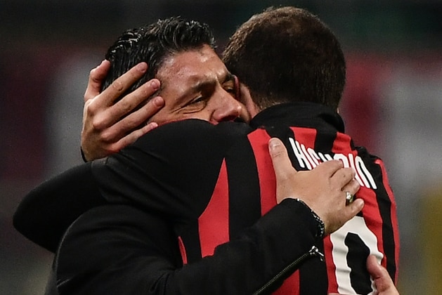AC Milan's Argentine forward Gonzalo Higuain (R) celebrates with AC Milan's Italian coach Gennaro Gattuso after scoring 2-1 during the Italian Serie A football match AC Milan vs Spal on December 29, 2018 at San Siro stadium in Milan. (Photo by Marco BERTORELLO / AFP)        (Photo credit should read MARCO BERTORELLO/AFP/Getty Images)
