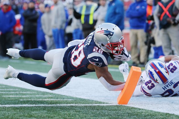FOXBOROUGH, MA - DECEMBER 23:  James White #28 of the New England Patriots rushes for a 27-yard touchdown during the second quarter against the Buffalo Bills at Gillette Stadium on December 23, 2018 in Foxborough, Massachusetts.  (Photo by Jim Rogash/Getty Images)