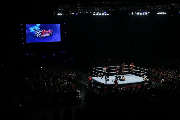 Wrestlers fight during a show at the AccorHotels Arena in Paris, as part of the WrestleMania Revenge Tour, the World Wrestling Entertainment (WWE) European tour, on April 22, 2016. / AFP / THOMAS SAMSON        (Photo credit should read THOMAS SAMSON/AFP/Getty Images)