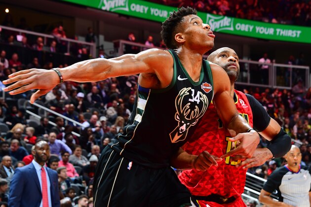 ATLANTA, GA - JANUARY 13: Giannis Antetokounmpo #34 of the Milwaukee Bucks and Vince Carter #15 of the Atlanta Hawks defend their positions during the game on January 13, 2019 at State Farm Arena in Atlanta, Georgia.  NOTE TO USER: User expressly acknowledges and agrees that, by downloading and/or using this Photograph, user is consenting to the terms and conditions of the Getty Images License Agreement. Mandatory Copyright Notice: Copyright 2019 NBAE (Photo by Scott Cunningham/NBAE via Getty Images)
