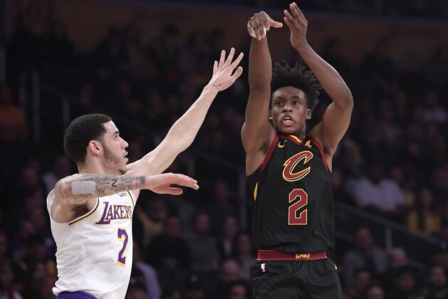 Cleveland Cavaliers guard Collin Sexton, right, shoots as Los Angeles Lakers guard Lonzo Ball defends during the first half of an NBA basketball game Sunday, Jan. 13, 2019, in Los Angeles. (AP Photo/Mark J. Terrill)