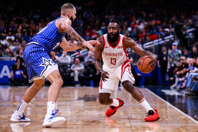 ORLANDO, FLORIDA - JANUARY 13: Evan Fournier #10 of the Orlando Magic attempts to block James Harden #13 of the Houston Rockets in the second quarter at Amway Center on January 13, 2019 in Orlando, Florida. NOTE TO USER: User expressly acknowledges and agrees that, by downloading and or using this photograph, User is consenting to the terms and conditions of the Getty Images License Agreement. (Photo by Harry Aaron/Getty Images)