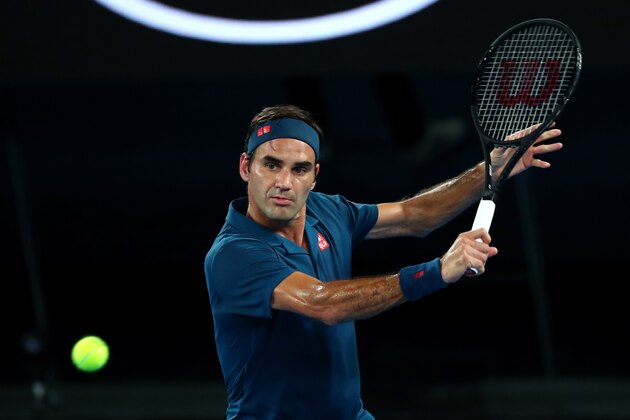 MELBOURNE, AUSTRALIA - JANUARY 14:  Roger Federer of Switzerland plays a backhand his first round match against Denis Istomin of Uzbekistan during day one of the 2019 Australian Open at Melbourne Park on January 14, 2019 in Melbourne, Australia.  (Photo by Michael Dodge/Getty Images)