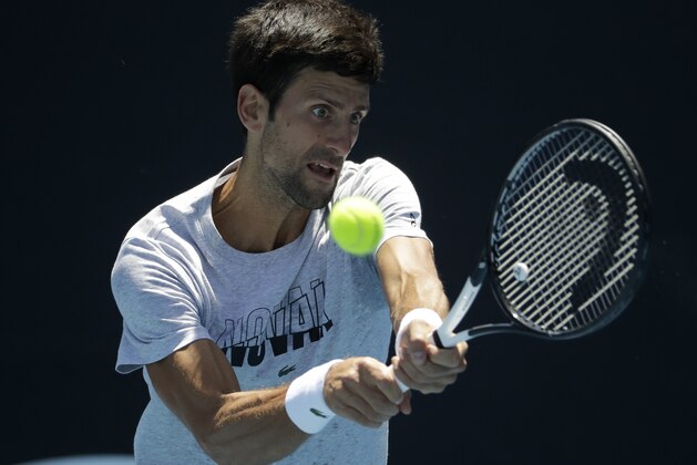 Serbia's Novak Djokovic makes a backhand return during a practice session at the Australian Open tennis championships in Melbourne, Australia, Sunday, Jan. 13, 2019. (AP Photo/Mark Schiefelbein)