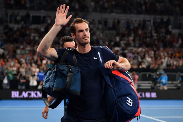 Britain's Andy Murray waves to supporters after his defeat against Spain's Roberto Bautista Agut during their men's singles match on day one of the Australian Open tennis tournament in Melbourne on January 14, 2019. (Photo by SAEED KHAN / AFP) / -- IMAGE RESTRICTED TO EDITORIAL USE - STRICTLY NO COMMERCIAL USE --        (Photo credit should read SAEED KHAN/AFP/Getty Images)