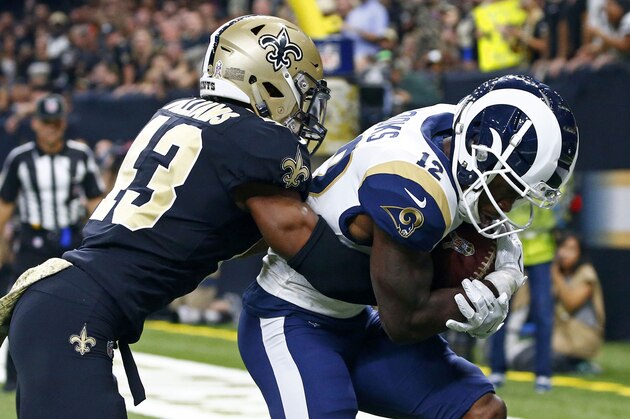 Los Angeles Rams wide receiver Brandin Cooks (12) pulls in a touchdown reception against New Orleans Saints free safety Marcus Williams (43) in the first half of an NFL football game in New Orleans, Sunday, Nov. 4, 2018. (AP Photo/Butch Dill)