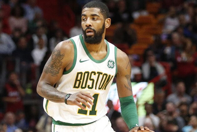 Boston Celtics guard Kyrie Irving (11) brings the ball up court against the Miami Heat during the second half of an NBA basketball game, Thursday, Jan. 10, 2019, in Miami. The Heat defeated the Celtics 115-99. (AP Photo/Joel Auerbach)