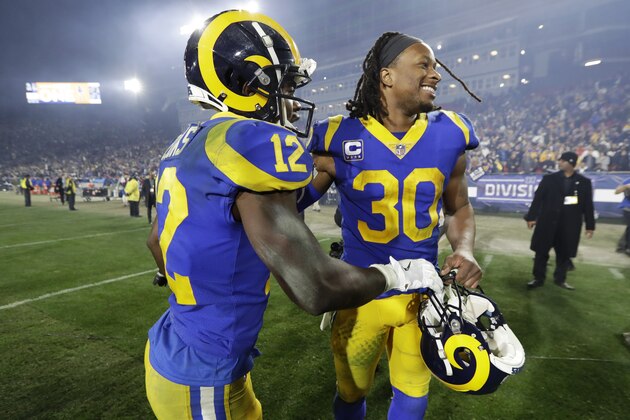 Los Angeles Rams running back Todd Gurley, right, and wide receiver Brandin Cooks celebrate after their win in an NFL divisional football playoff game against the Dallas Cowboys Saturday, Jan. 12, 2019, in Los Angeles. (AP Photo/Marcio Jose Sanchez)