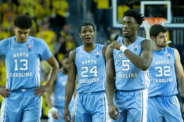 ANN ARBOR, MI - NOVEMBER 28: Nassir Little #5 of the North Carolina Tar Heels and teammates Cameron Johnson #13, Kenny Williams #24 and Luke Maye #32 of the North Carolina Tar Heels walk to the sidelines during a timeout in the second half of the game against the Michigan Wolverines at Crisler Center on November 28, 2018 in Ann Arbor, Michigan. Michigan defeated North Carolina Tar Heels 84-67. (Photo by Leon Halip/Getty Images)