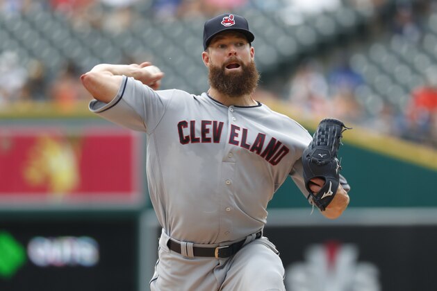 Cleveland Indians pitcher Corey Kluber throws against the Detroit Tigers in the first inning of a baseball game in Detroit, Sunday, July 29, 2018. (AP Photo/Paul Sancya)