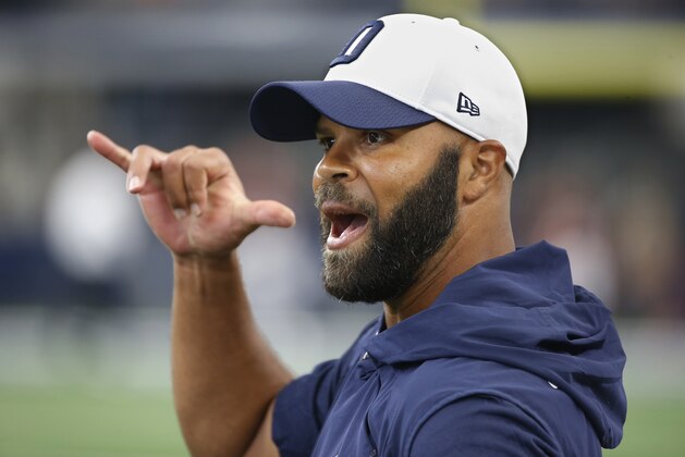 Dallas Cowboys assistant coach Kris Richard walks on the field before an preseason NFL Football game in Arlington, Texas, Saturday, Aug. 18, 2018.(AP Photo/Ron Jenkins)