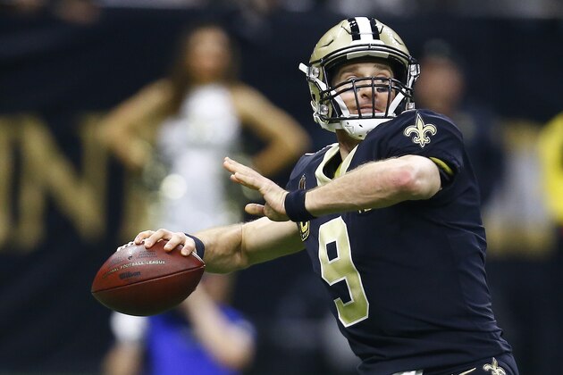 New Orleans Saints quarterback Drew Brees (9) works against against the Philadelphia Eagles in the first half of an NFL divisional playoff football game in New Orleans, Sunday, Jan. 13, 2019. (AP Photo/Butch Dill)
