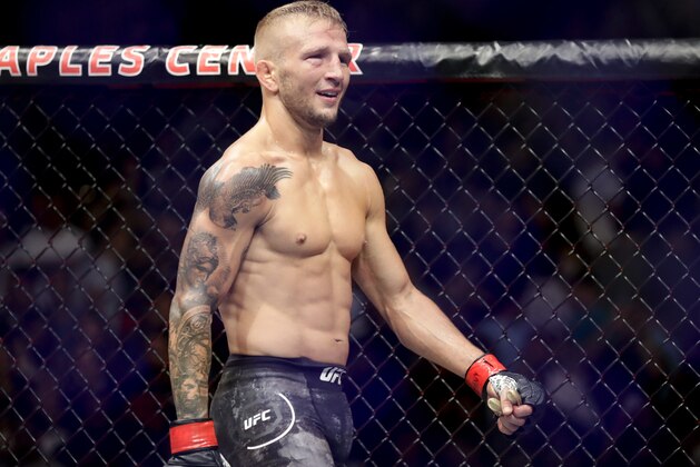 T.J. Dillashaw smiles after his win against Cody Garbrandt during their UFC title bantamweight mixed martial arts bout at UFC 227 in Los Angeles, Saturday, Aug. 4, 2018. (AP Photo/Chris Carlson)