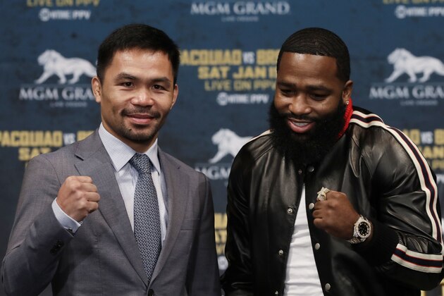 CORRECTS SPELLING TO PACQUIAO, NOT PAQUIAO AS ORIGINALLY SENT - Manny Pacquiao, left, and Adrien Broner pose for photographers at a news conference, Monday, Nov. 19, 2018, in New York. Pacquiao will defend his World Boxing Association welterweight title against Broner on Jan. 19, 2019, in Las Vegas. (AP Photo/Mark Lennihan)