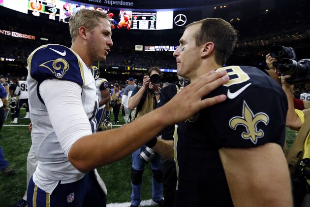 New Orleans Saints quarterback Drew Brees (9) greets Los Angeles Rams quarterback Jared Goff after an NFL football game in New Orleans, Sunday, Nov. 27, 2016. The Saints won 49-21.  (AP Photo/Butch Dill)