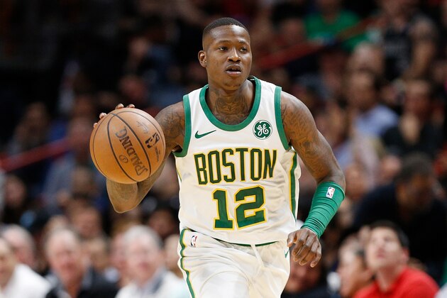 MIAMI, FL - JANUARY 10:  Terry Rozier #12 of the Boston Celtics dribbles with the ball against the Miami Heat at American Airlines Arena on January 10, 2019 in Miami, Florida. NOTE TO USER: User expressly acknowledges and agrees that, by downloading and or using this photograph, User is consenting to the terms and conditions of the Getty Images License Agreement.  (Photo by Michael Reaves/Getty Images)