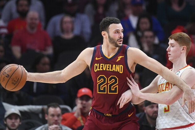 Cleveland Cavaliers forward Larry Nance Jr. (22) fends off Atlanta Hawks guard Kevin Huerter during an NBA basketball game, Saturday, Dec. 29, 2018, in Atlanta. (AP Photo/John Amis)