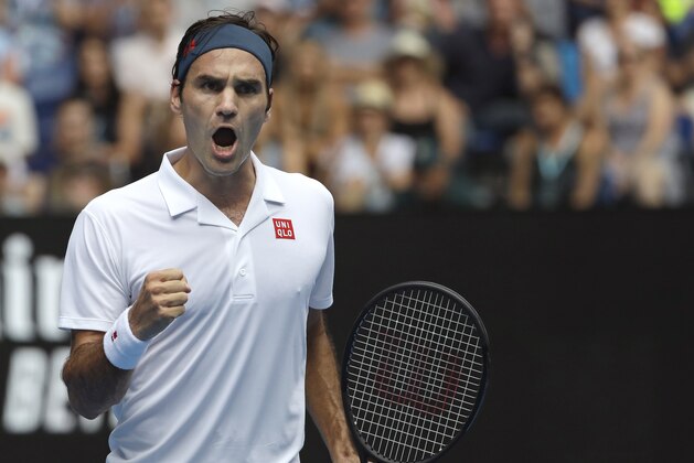 Switzerland's Roger Federer reacts after winning the first set against Britain's Daniel Evans in their second round match at the Australian Open tennis championships in Melbourne, Australia, Wednesday, Jan. 16, 2019. (AP Photo/Mark Schiefelbein)