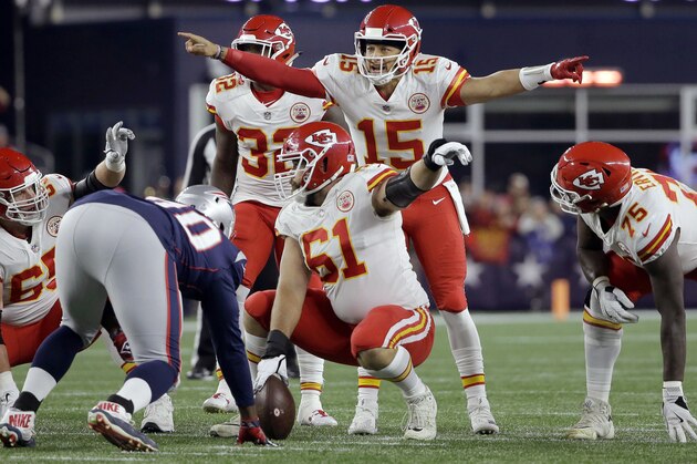 Kansas City Chiefs quarterback Patrick Mahomes (15) calls signals at the line of scrimmage during the first half of an NFL football game against the New England Patriots, Sunday, Oct. 14, 2018, in Foxborough, Mass. (AP Photo/Steven Senne)