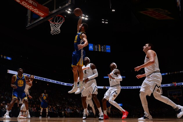 DENVER, CO - JANUARY 15:  Klay Thompson #11 of the Golden State Warriors dunks the ball against the Denver Nuggets on January 15, 2019 at the Pepsi Center in Denver, Colorado. NOTE TO USER: User expressly acknowledges and agrees that, by downloading and/or using this Photograph, user is consenting to the terms and conditions of the Getty Images License Agreement. Mandatory Copyright Notice: Copyright 2019 NBAE (Photo by Bart Young/NBAE via Getty Images)