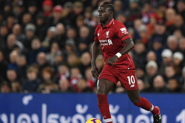 Liverpool's Senegalese striker Sadio Mane runs with the ball during the English Premier League football match between Liverpool and Arsenal at Anfield in Liverpool, north west England on December 29, 2018. (Photo by Paul ELLIS / AFP) / RESTRICTED TO EDITORIAL USE. No use with unauthorized audio, video, data, fixture lists, club/league logos or 'live' services. Online in-match use limited to 120 images. An additional 40 images may be used in extra time. No video emulation. Social media in-match use limited to 120 images. An additional 40 images may be used in extra time. No use in betting publications, games or single club/league/player publications. /         (Photo credit should read PAUL ELLIS/AFP/Getty Images)