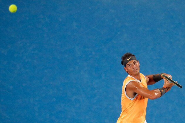 Spain's Rafael Nadal hits a return against Australia's Matthew Ebden during their men's singles match on day three of the Australian Open tennis tournament in Melbourne on January 16, 2019. (Photo by DAVID GRAY / AFP) / -- IMAGE RESTRICTED TO EDITORIAL USE - STRICTLY NO COMMERCIAL USE --        (Photo credit should read DAVID GRAY/AFP/Getty Images)