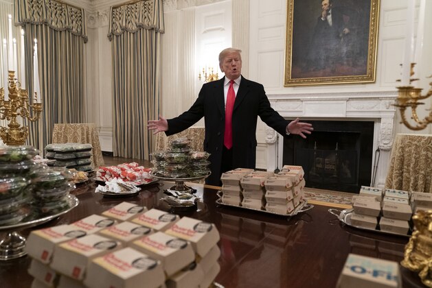 WASHINGTON, DC - JANUARY 14: (AFP OUT) U.S President Donald Trump presents fast food to be served to the Clemson Tigers football team to celebrate their Championship at the White House on January 14, 2019 in Washington, DC. (Photo by Chris Kleponis-Pool/Getty Images)