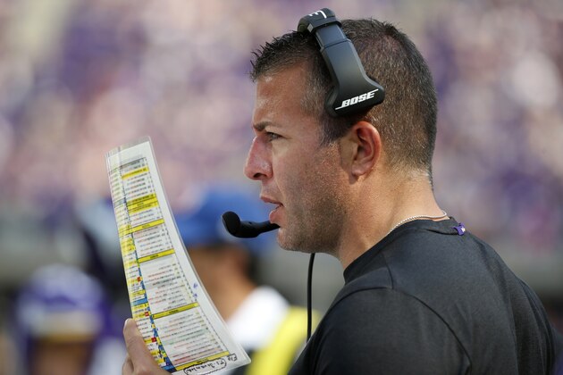 Minnesota Vikings offensive coordinator John DeFilippo looks at his play sheet during the second half of an NFL football game against the Buffalo Bills, Sunday, Sept. 23, 2018, in Minneapolis. The Bills won 27-6. (AP Photo/Bruce Kluckhohn)