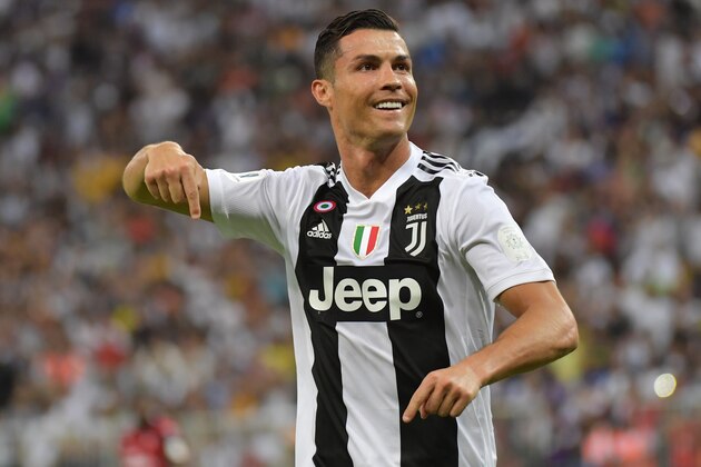 Juventus' Portuguese forward Cristiano Ronaldo celebrates his goal during their Supercoppa Italiana final between Juventus and AC Milan at the King Abdullah Sports City Stadium in Jeddah on January 16, 2019. (Photo by GIUSEPPE CACACE / AFP)        (Photo credit should read GIUSEPPE CACACE/AFP/Getty Images)