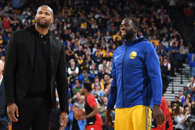 OAKLAND, CA - JANUARY 3:  DeMarcus Cousins #0 and Draymond Green #23 of the Golden State Warriors look on during the game against the Houston Rockets on January 3, 2019 at ORACLE Arena in Oakland, California. NOTE TO USER: User expressly acknowledges and agrees that, by downloading and or using this photograph, user is consenting to the terms and conditions of Getty Images License Agreement. Mandatory Copyright Notice: Copyright 2019 NBAE (Photo by Andrew D. Bernstein/NBAE via Getty Images)