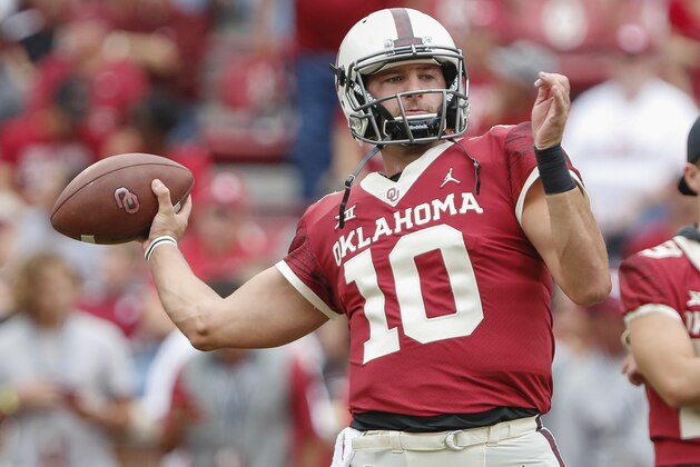 Oklahoma quarterback Austin Kendall (10) warms up before the start of an NCAA college football game against Baylor in Norman, Okla., Saturday, Sept. 29, 2018. (AP Photo/Alonzo Adams)