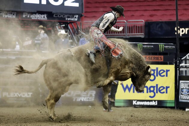 Mason Lowe rides Cochise during the Professional Bull Riders, Built Ford Tough Series at the Sprint Center, Saturday, Feb. 11, 2017, in Kansas City, Mo. (AP Photo/Colin E. Braley)
