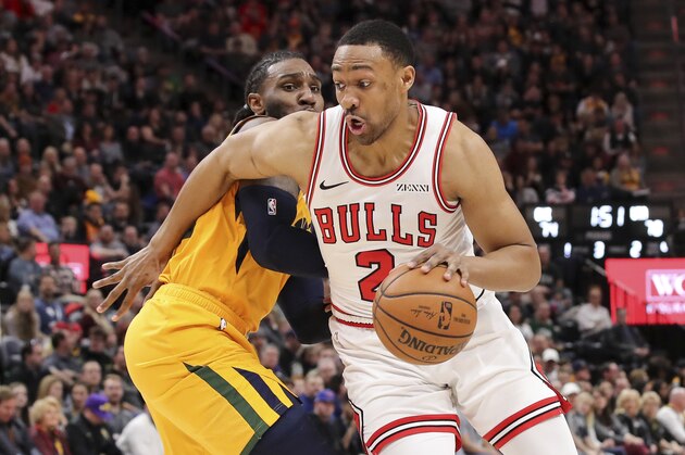 Chicago Bulls forward Jabari Parker (2) dribbles past Utah Jazz forward Jae Crowder during the third quarter of an NBA basketball game, Saturday, Jan. 12, 2019, in Salt Lake City. Utah won 110-102. (AP Photo/Chris Nicoll)