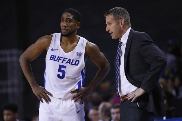 Buffalo guard CJ Massinburg (5) and head coach Nate Oats talk during the second half of an NCAA college Basketball game against Le Moyne, Wednesday, Dec. 5, 2018, in Buffalo N.Y. (AP Photo/Jeffrey T. Barnes)