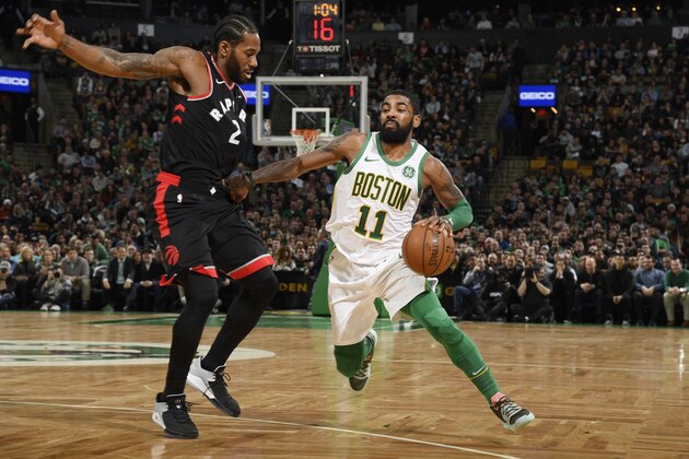 BOSTON, MA - JANUARY 16:  Kawhi Leonard #2 of the Toronto Raptors defends against Kyrie Irving #11 of the Boston Celtics on January 16, 2019 at the TD Garden in Boston, Massachusetts.  NOTE TO USER: User expressly acknowledges and agrees that, by downloading and or using this photograph, User is consenting to the terms and conditions of the Getty Images License Agreement. Mandatory Copyright Notice: Copyright 2019 NBAE  (Photo by Brian Babineau/NBAE via Getty Images)