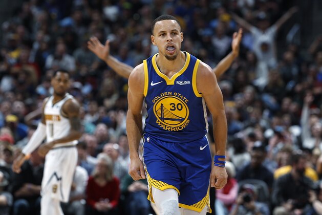 Golden State Warriors guard Stephen Curry reacts after hitting a 3-point basket against the Denver Nuggets in the second half of an NBA basketball game, Tuesday, Jan. 15, 2019, in Denver. The Warriors won 142-111. (AP Photo/David Zalubowski)