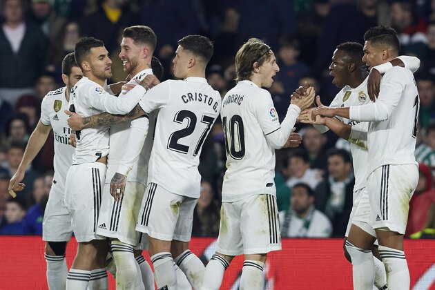 SEVILLE, SPAIN - JANUARY 13: Dani Ceballos of Real Madrid celebrates after scoring his team's second goal with his teammates during the La Liga match between Real Betis Balompie and Real Madrid CF at Estadio Benito Villamarin on January 13, 2019 in Seville, Spain. (Photo by Quality Sport Images/Getty Images)