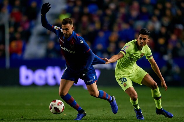 VALENCIA, SPAIN - JANUARY 10: Borja Mayoral (L) of Levante UD competes for the ball with Chumi of FC Barcelona during the Copa del Rey Round of 16 match between Levante UD and FC Barcelona at Ciutat de Valencia on January 10, 2019 in Valencia, Spain. (Photo by David Aliaga/MB Media/Getty Images)