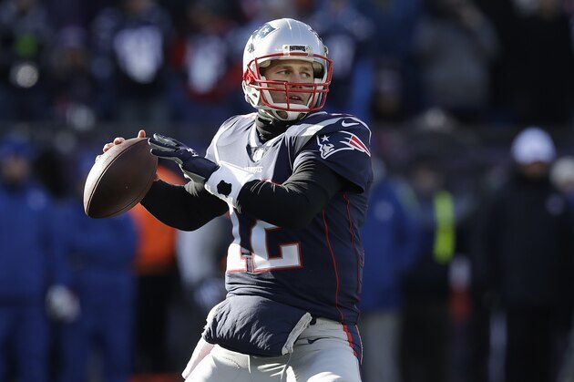 New England Patriots quarterback Tom Brady drops back to pass against the Los Angeles Chargers defensive during the first half of an NFL divisional playoff football game, Sunday, Jan. 13, 2019, in Foxborough, Mass. (AP Photo/Charles Krupa)