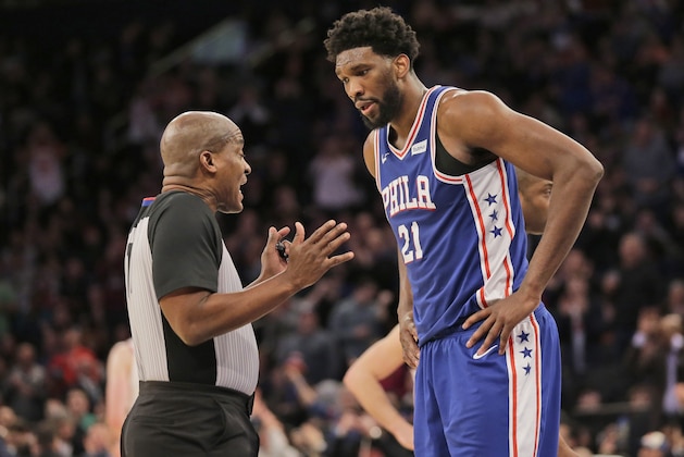 Philadelphia 76ers' Joel Embiid, right, argues with a referee during the second half of the NBA basketball game against the New York Knicks, Sunday, Jan. 13, 2019, in New York. The 76ers defeated the Knicks 108-105. (AP Photo/Seth Wenig)