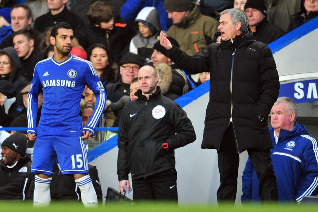 Chelsea's Portuguese manager Jose Mourinho (R) gives instructions to Chelsea's Egyptian midfielder Mohamed Salah (L) during the English Premier League football match between Chelsea and Newcastle United at Stamford Bridge in west London on February 8, 2014. Chelsea won the game 3-0. AFP PHOTO / GLYN KIRK

RESTRICTED TO EDITORIAL USE. No use with unauthorized audio, video, data, fixture lists, club/league logos or live services. Online in-match use limited to 45 images, no video emulation. No use in betting, games or single club/league/player publications.        (Photo credit should read GLYN KIRK/AFP/Getty Images)