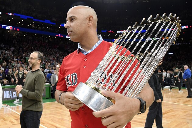 BOSTON, MA - NOVEMBER 1: Alex Cora of the Boston Red Sox holds the World Series Trophy during the game between the Milwaukee Bucks and the Boston Celtics on November 1, 2018 at the TD Garden in Boston, Massachusetts. NOTE TO USER: User expressly acknowledges and agrees that, by downloading and/or using this photograph, user is consenting to the terms and conditions of the Getty Images License Agreement. Mandatory Copyright Notice: Copyright 2018 NBAE (Photo by Brian Babineau/NBAE via Getty Images)