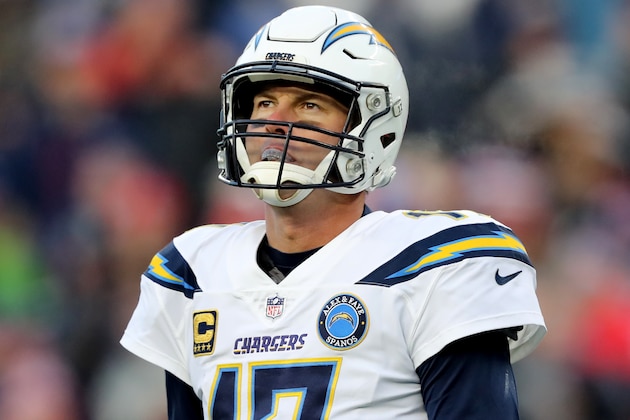 FOXBOROUGH, MASSACHUSETTS - JANUARY 13: Philip Rivers #17 of the Los Angeles Chargers reacts during the fourth quarter in the AFC Divisional Playoff Game against the New England Patriots at Gillette Stadium on January 13, 2019 in Foxborough, Massachusetts. (Photo by Elsa/Getty Images)