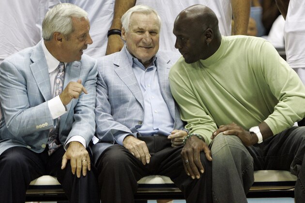 North Carolina coach Roy Williams, from left, former coach Dean Smith, and former player Michael Jordan chat prior to a North Carolina men's professional alumni basketball game in Chapel Hill, N.C., Friday, Sept. 4, 2009. The alumni game, featuring North Carolina's current NBA and other professional alumni is the kickoff event celebrating the 100th year of the Tar Heel basketball program. (AP Photo/Gerry Broome)