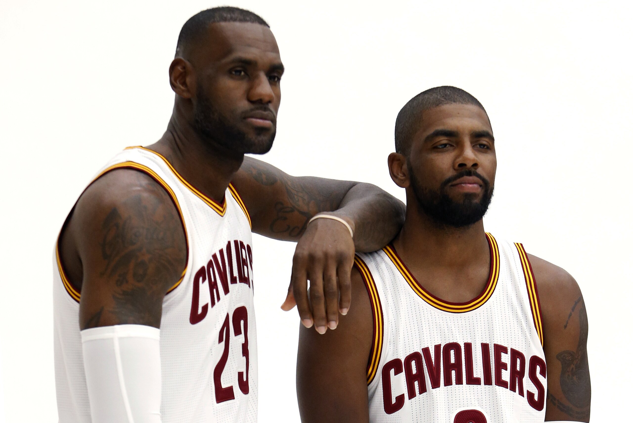 Cleveland Cavaliers forward LeBron James (23) and guard Kyrie Irving pose for photos during the NBA basketball team's media day, Monday, Sept. 26, 2016, in Independence, Ohio. (AP Photo/Ron Schwane)